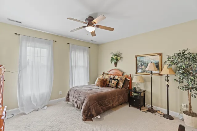a front view of a house with swimming pool and porch