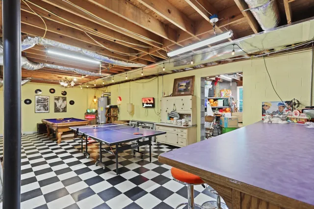 a front view of a house with a garden and plants