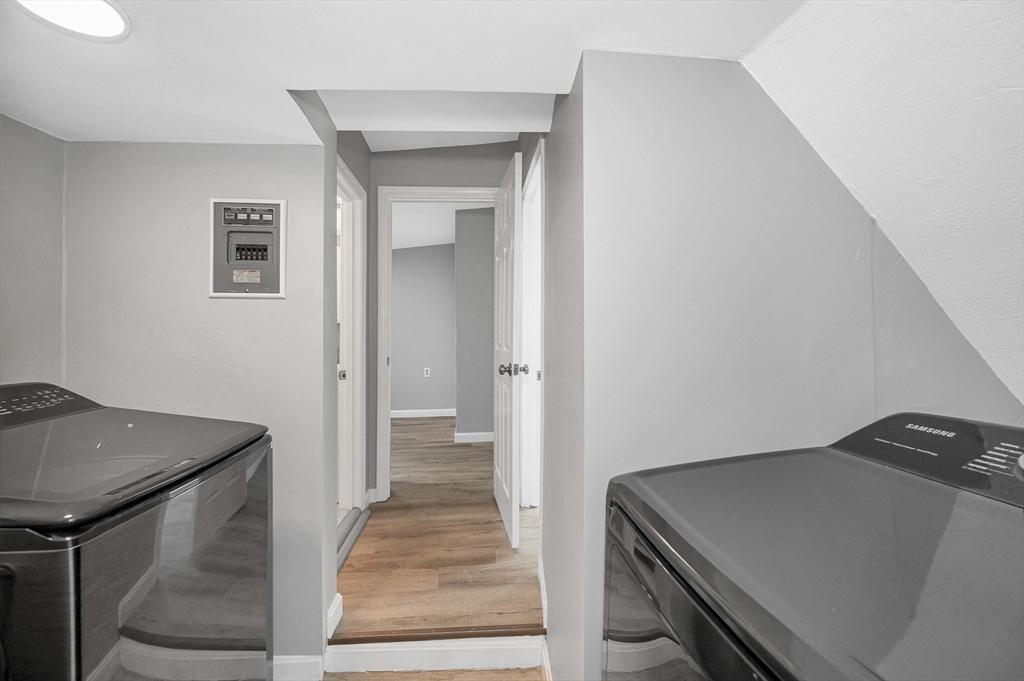 213 Prospect Street Lawrence, MA 01841 - Photo 14 of 33 a view of a hallway with wooden floor and staircase