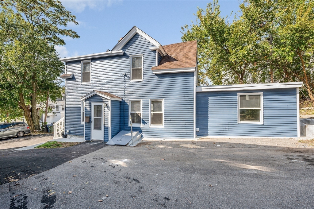 213 Prospect Street Lawrence, MA 01841 - Photo 2 of 33 a view of a house with a yard