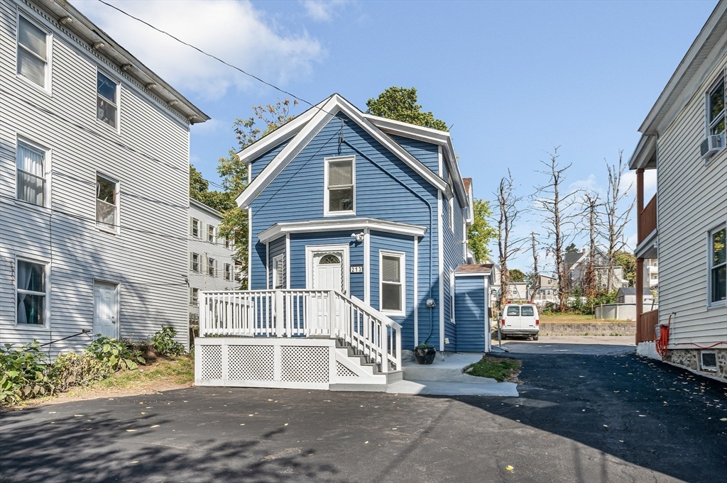 213 Prospect Street Lawrence, MA 01841 - Photo 28 of 33 a front view of a house with a yard