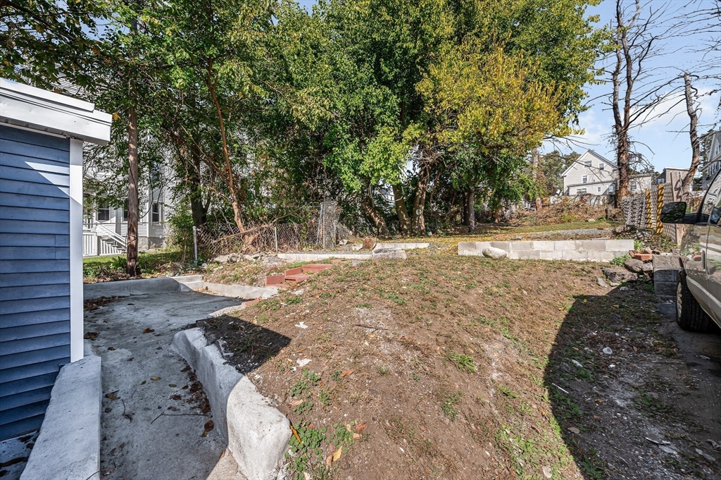 213 Prospect Street Lawrence, MA 01841 - Photo 29 of 33 a view of a yard with large trees