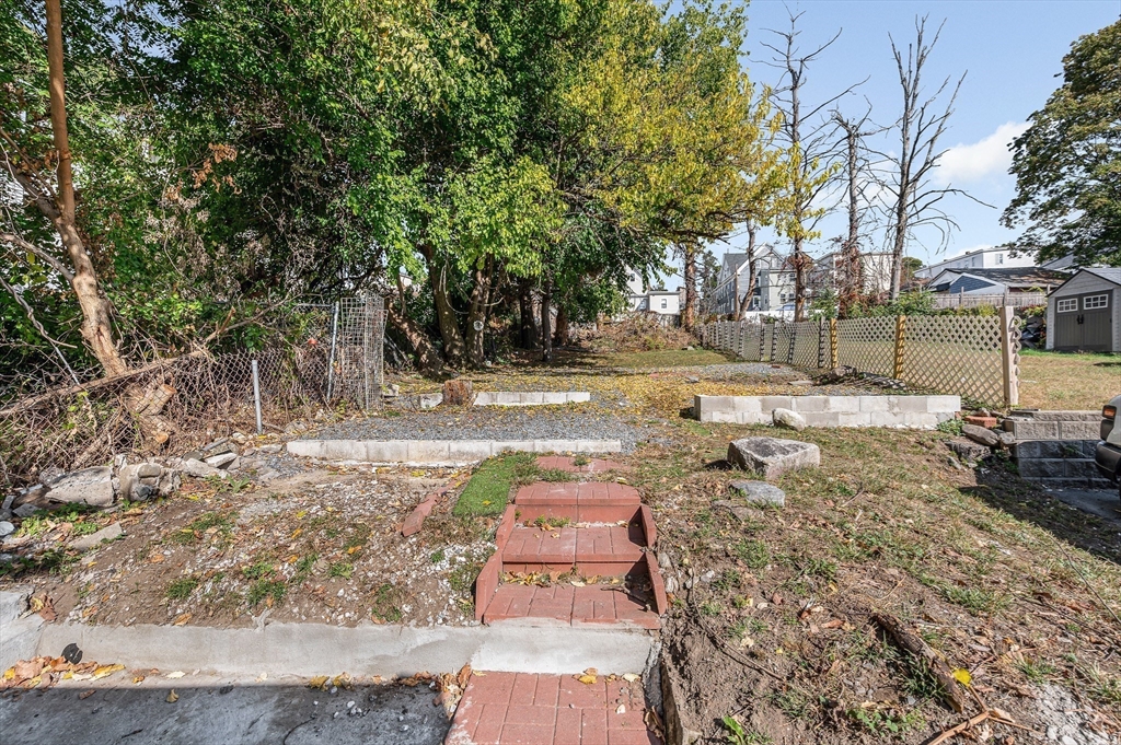 213 Prospect Street Lawrence, MA 01841 - Photo 30 of 33 a view of a yard with trees