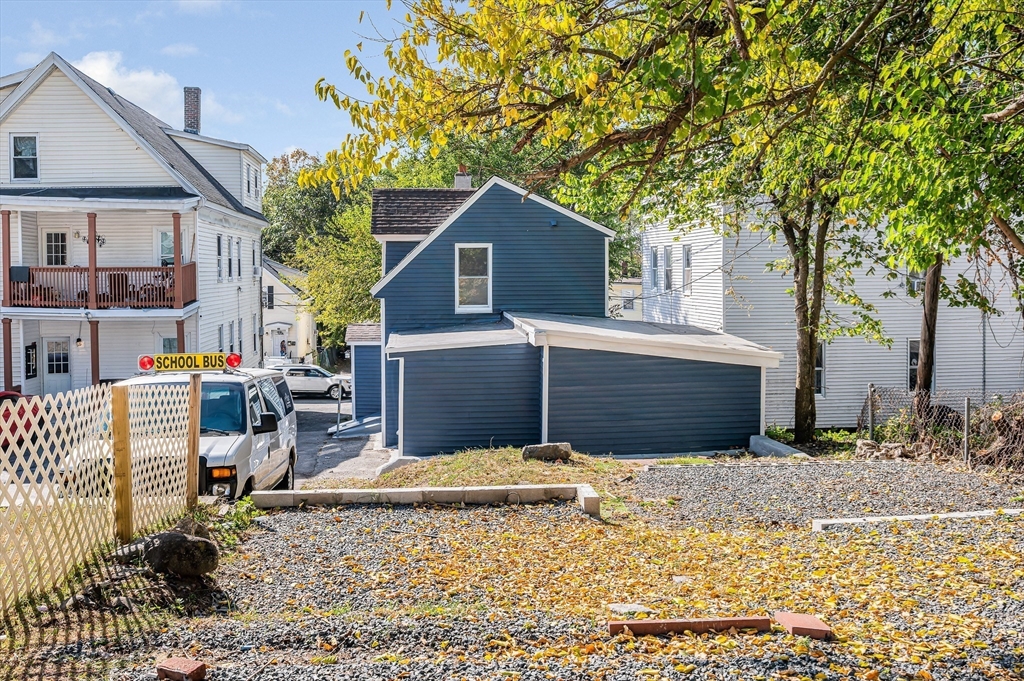 213 Prospect Street Lawrence, MA 01841 - Photo 33 of 33 a view of house with backyard and trees