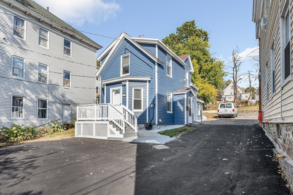 213 Prospect Street Lawrence, MA 01841 - Photo 4 of 33 a view of a big house with a street