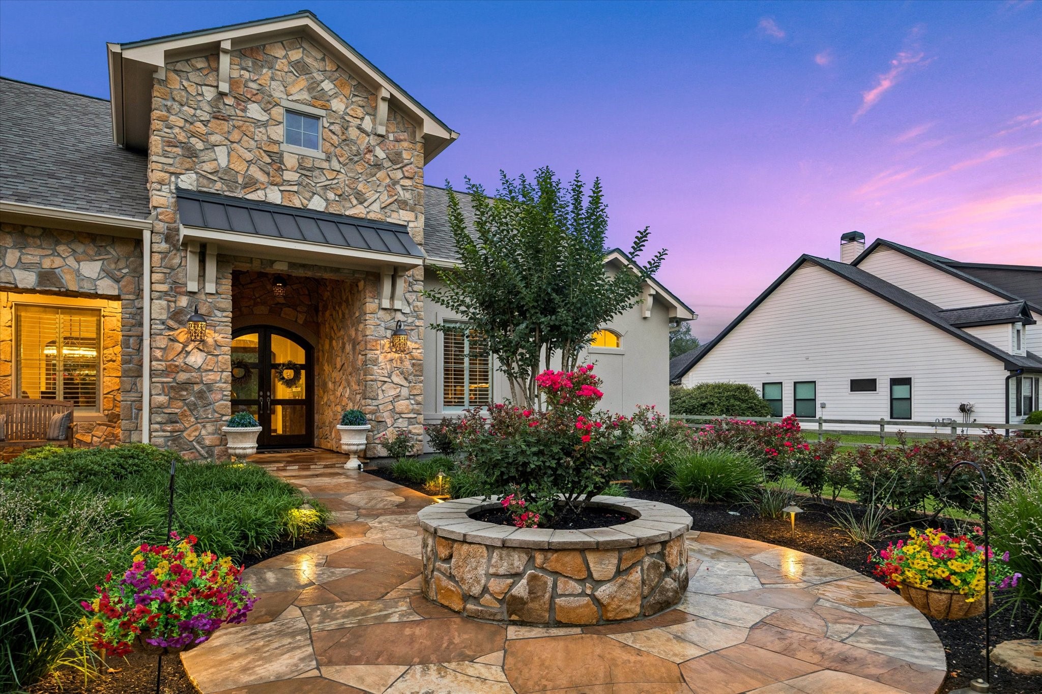 32102 Fulbrook Commons Fulshear, TX 77441 - Photo 15 of 50 A winding flagstone approach leads through the vibrant garden to a welcoming covered entry.