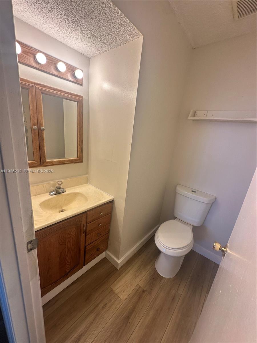 27347 Southwest 117th Place Homestead, FL 33032 - Photo 12 of 37 a bathroom with a sink and a mirror