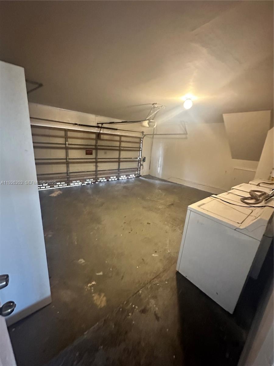 27347 Southwest 117th Place Homestead, FL 33032 - Photo 15 of 37 a view of a room with racks on the wall