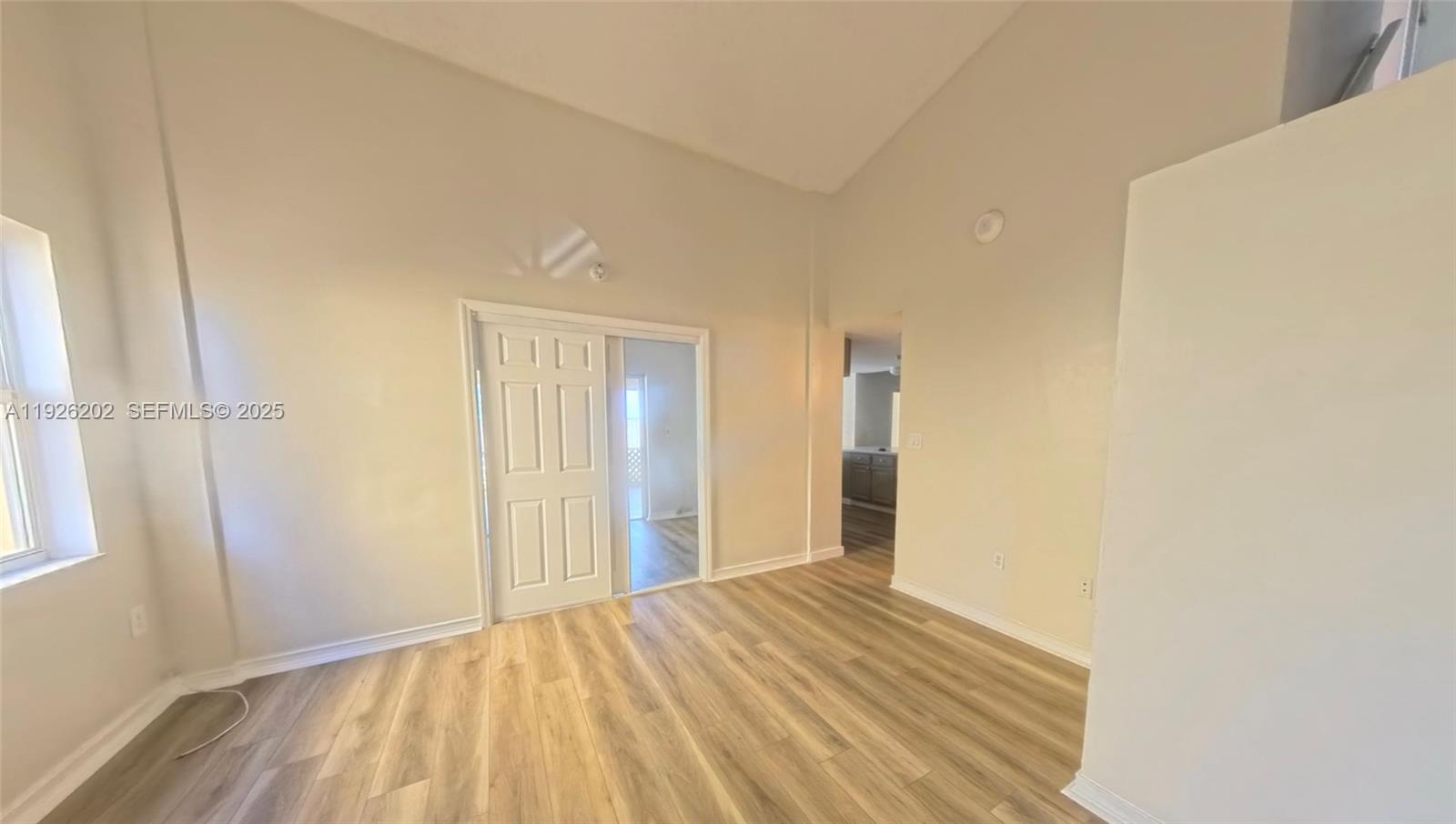 27347 Southwest 117th Place Homestead, FL 33032 - Photo 3 of 37 a view of a bedroom with wooden floor and bathroom