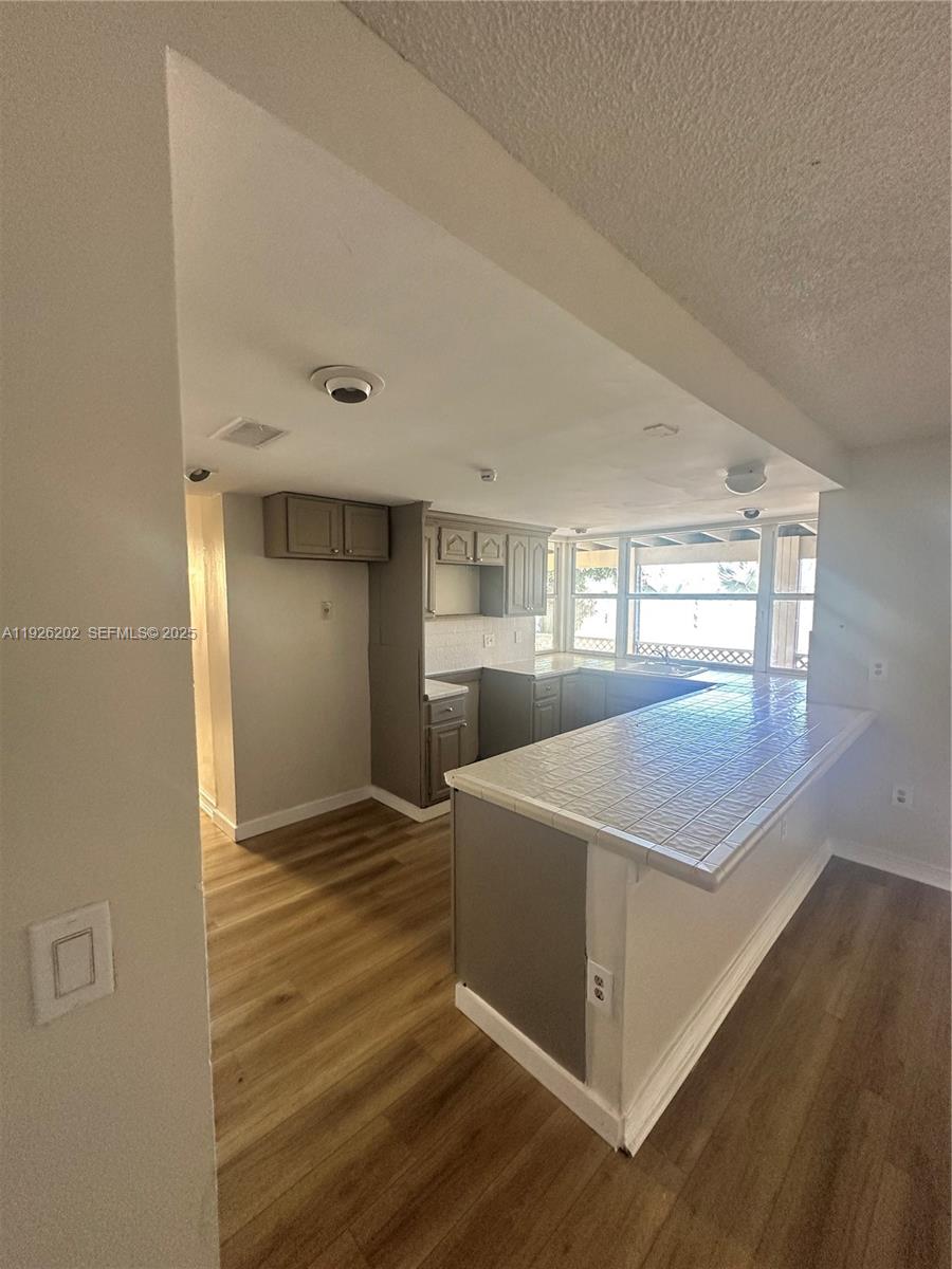 27347 Southwest 117th Place Homestead, FL 33032 - Photo 5 of 37 a view of empty room with wooden floor