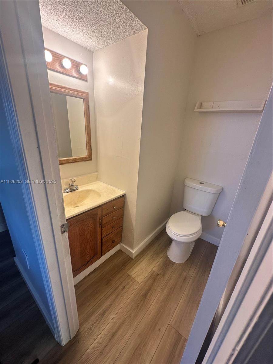 27347 Southwest 117th Place Homestead, FL 33032 - Photo 6 of 37 a bathroom with a sink and a mirror