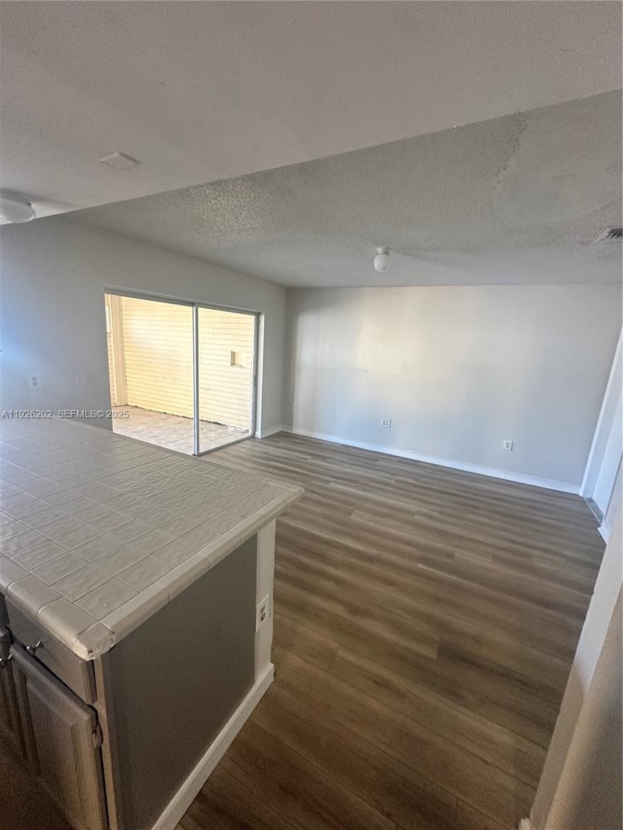 27347 Southwest 117th Place Homestead, FL 33032 - Photo 8 of 37 a view of an empty room and window