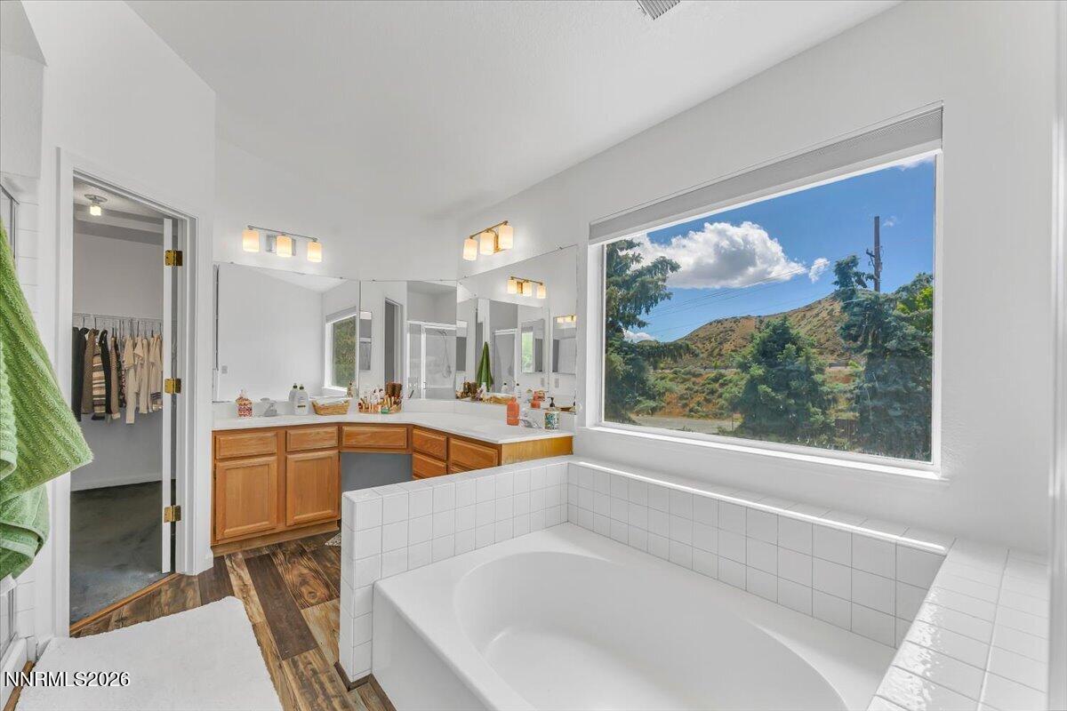 10 Eagle Claw Court Reno, NV 89523 - Photo 23 of 36 a large white tub sitting in a bathroom next to a window