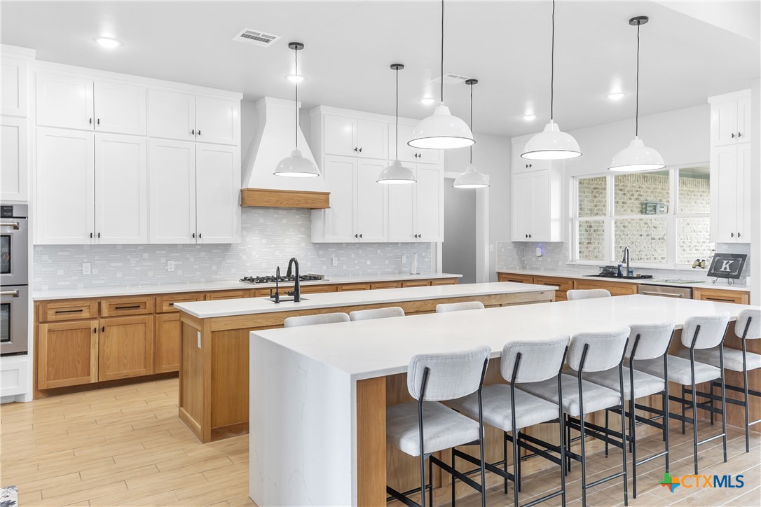 13428 Knob Hill Road Rogers, TX 76569 - Photo 15 of 41 a large kitchen with lots of counter space and a sink