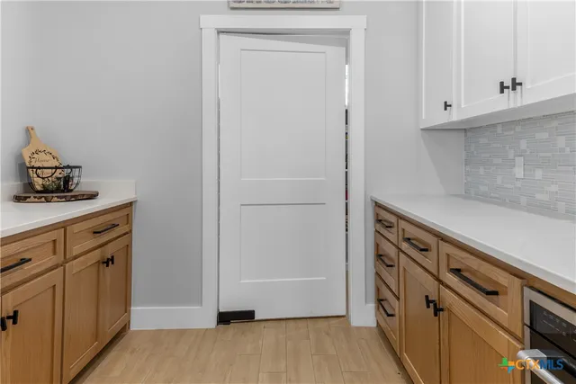 a view of a kitchen with sink dryer and washer