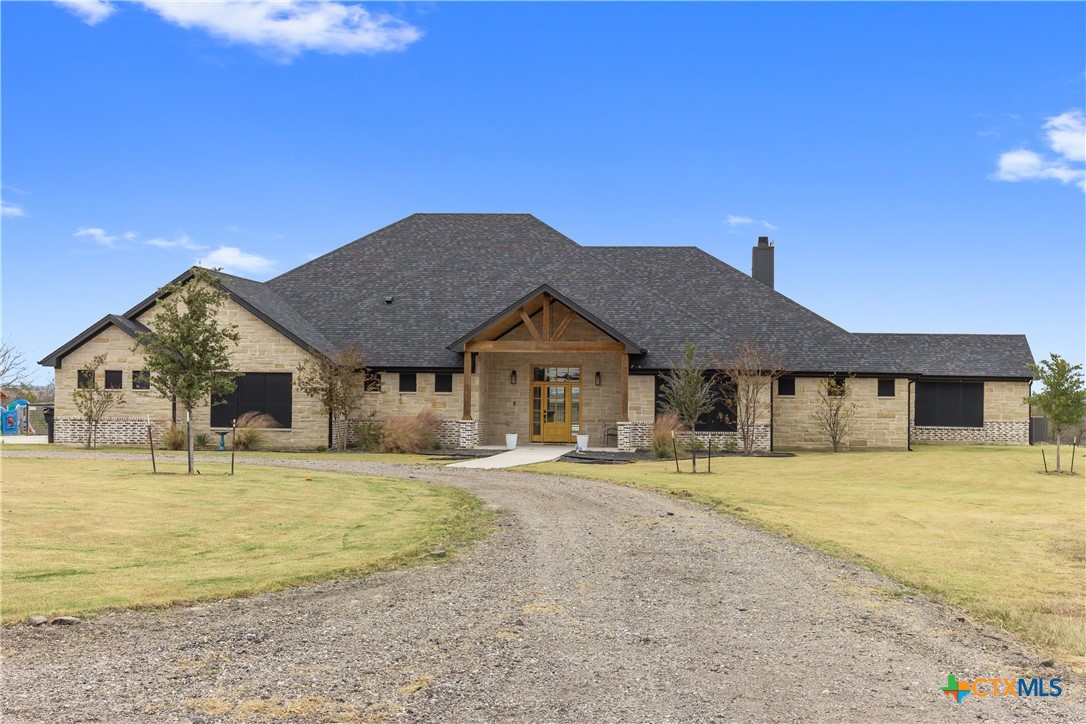 13428 Knob Hill Road Rogers, TX 76569 - Photo 2 of 41 a front view of a house with a yard