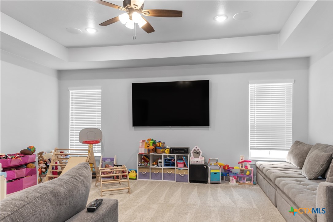 13428 Knob Hill Road Rogers, TX 76569 - Photo 23 of 41 a living room with furniture and a flat screen tv