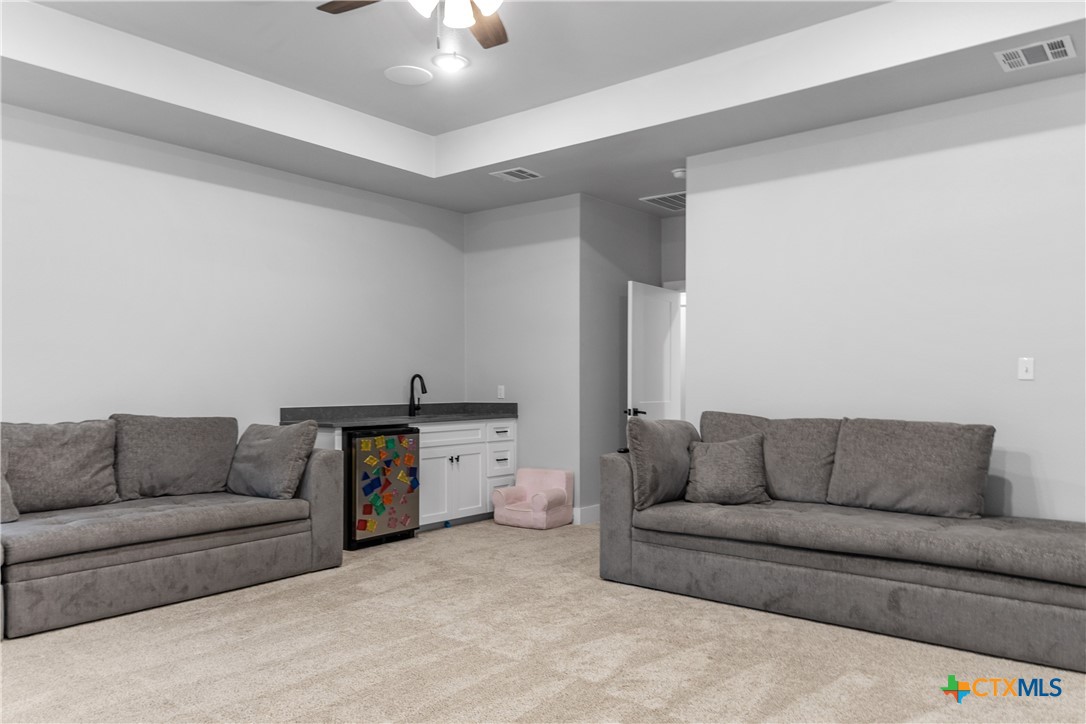 13428 Knob Hill Road Rogers, TX 76569 - Photo 24 of 41 a living room with furniture and a couch