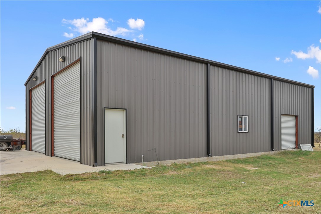 13428 Knob Hill Road Rogers, TX 76569 - Photo 30 of 41 a view of an empty room with closet and wooden floor
