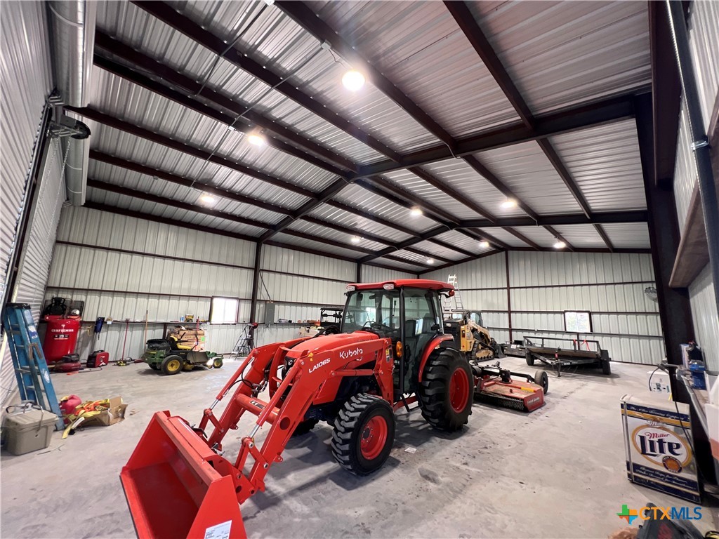 13428 Knob Hill Road Rogers, TX 76569 - Photo 31 of 41 a view of parking garage with cars