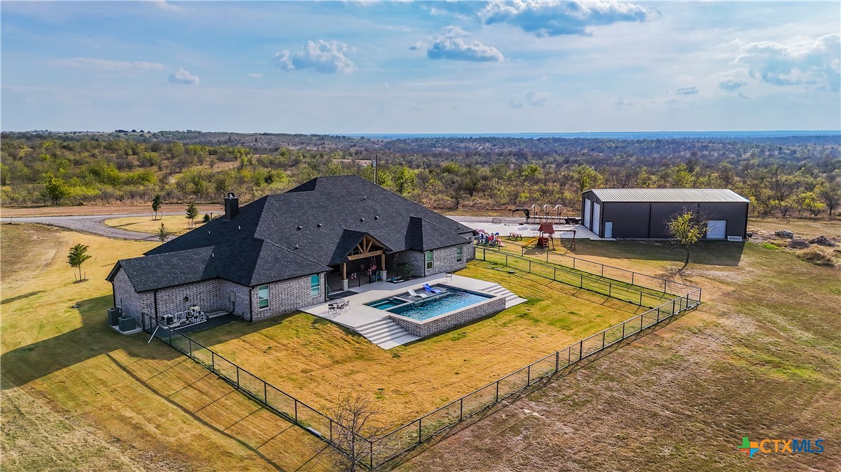 13428 Knob Hill Road Rogers, TX 76569 - Photo 32 of 41 an aerial view of residential houses with outdoor space