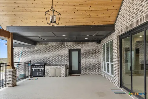 a view of a living room and a balcony