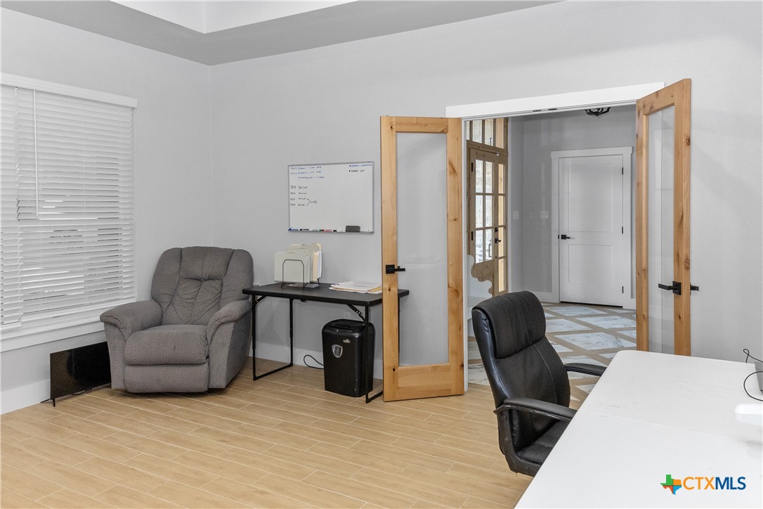 13428 Knob Hill Road Rogers, TX 76569 - Photo 9 of 41 a living room with furniture and a window