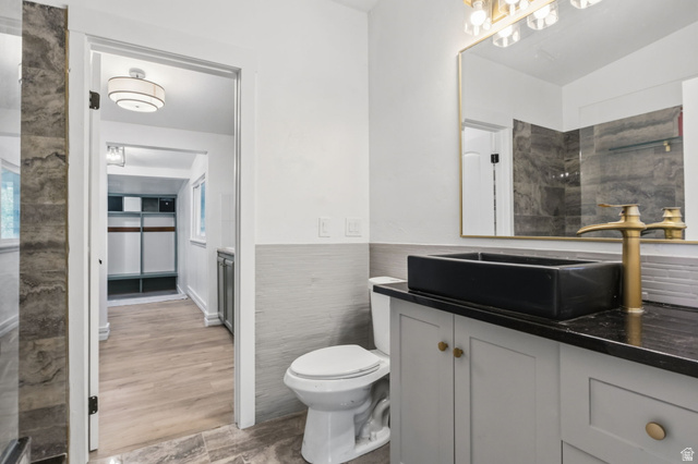 4270 River Road Oakley, UT 84055 - Photo 30 of 46 Bathroom featuring a vessel sink, gold-finish faucet, and coordinating vanity with gold-tone hardware