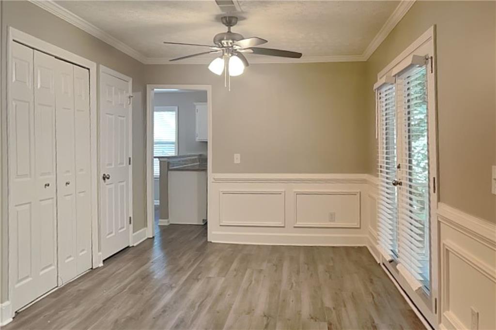 335 Olde Bridge Way Johns Creek, GA 30022 - Photo 5 of 19 wooden floor in an empty room with a window