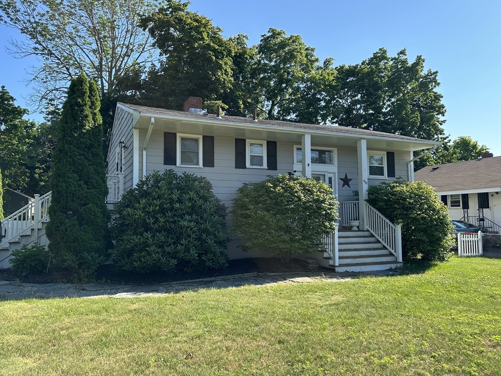 a front view of a house with a yard