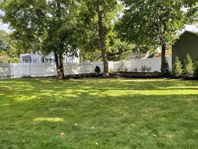 a view of a tree in front of a house