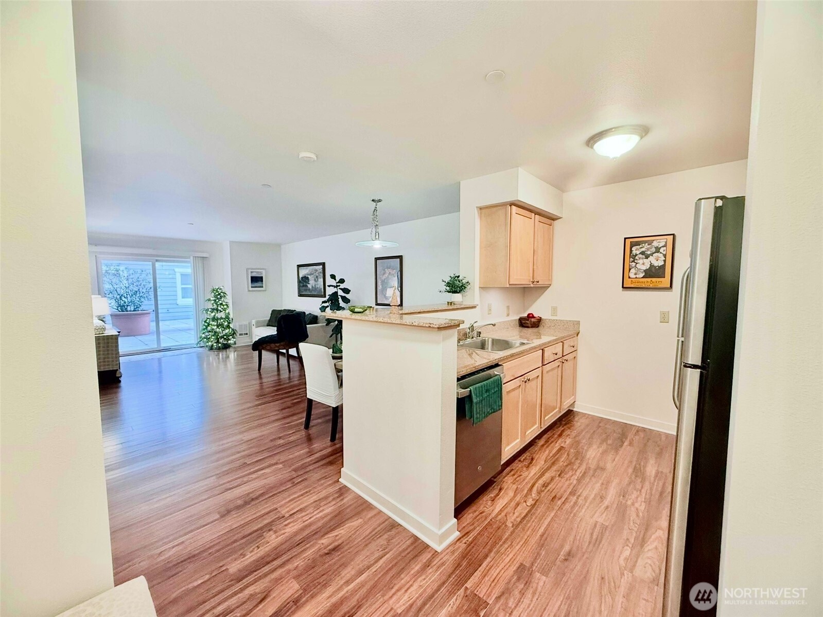 300 High School Road Northeast, Unit 203 Bainbridge Island, WA 98110 - Photo 2 of 13 a kitchen with stainless steel appliances a white stove top oven a sink and a refrigerator