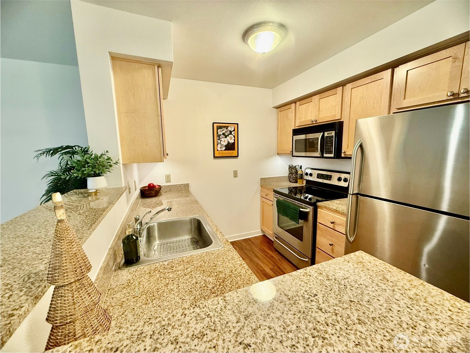 300 High School Road Northeast, Unit 203 Bainbridge Island, WA 98110 - Photo 4 of 13 a kitchen with a refrigerator sink and microwave