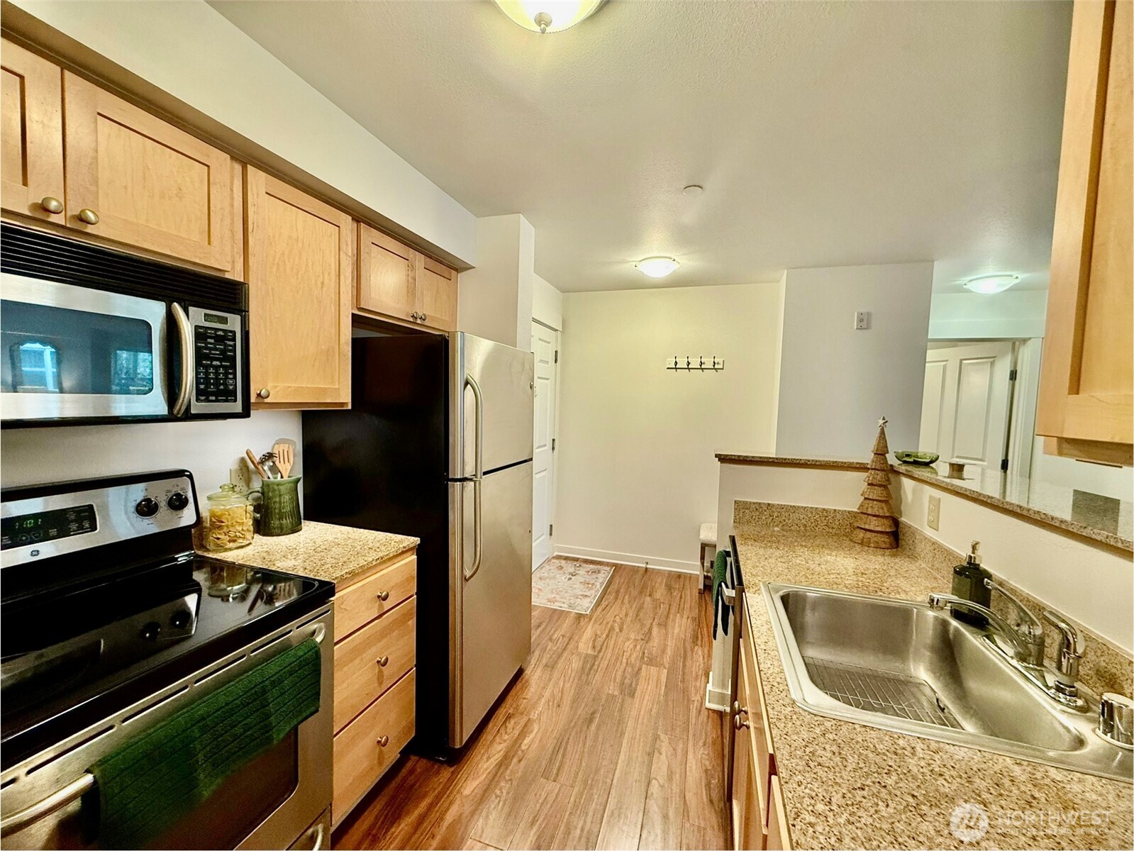 300 High School Road Northeast, Unit 203 Bainbridge Island, WA 98110 - Photo 5 of 13 a kitchen with a sink stove and refrigerator