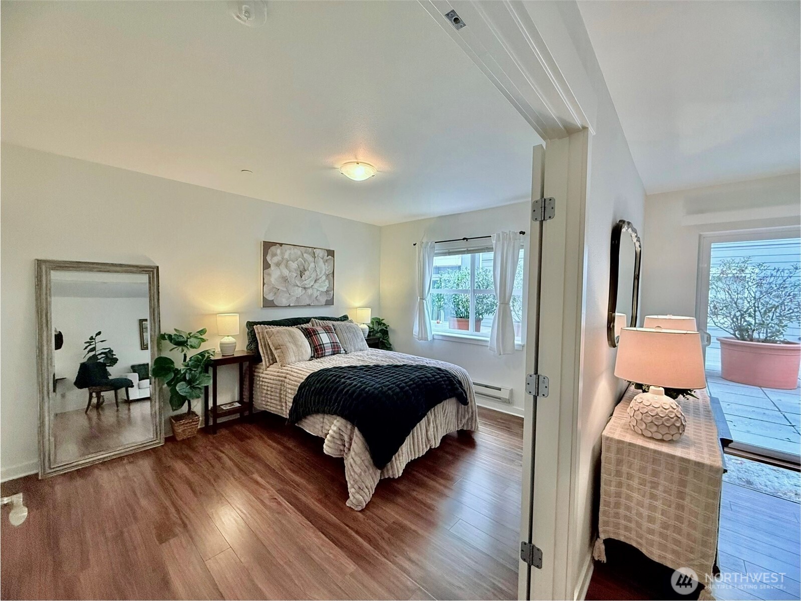 300 High School Road Northeast, Unit 203 Bainbridge Island, WA 98110 - Photo 9 of 13 a bedroom with a bed and wooden floor