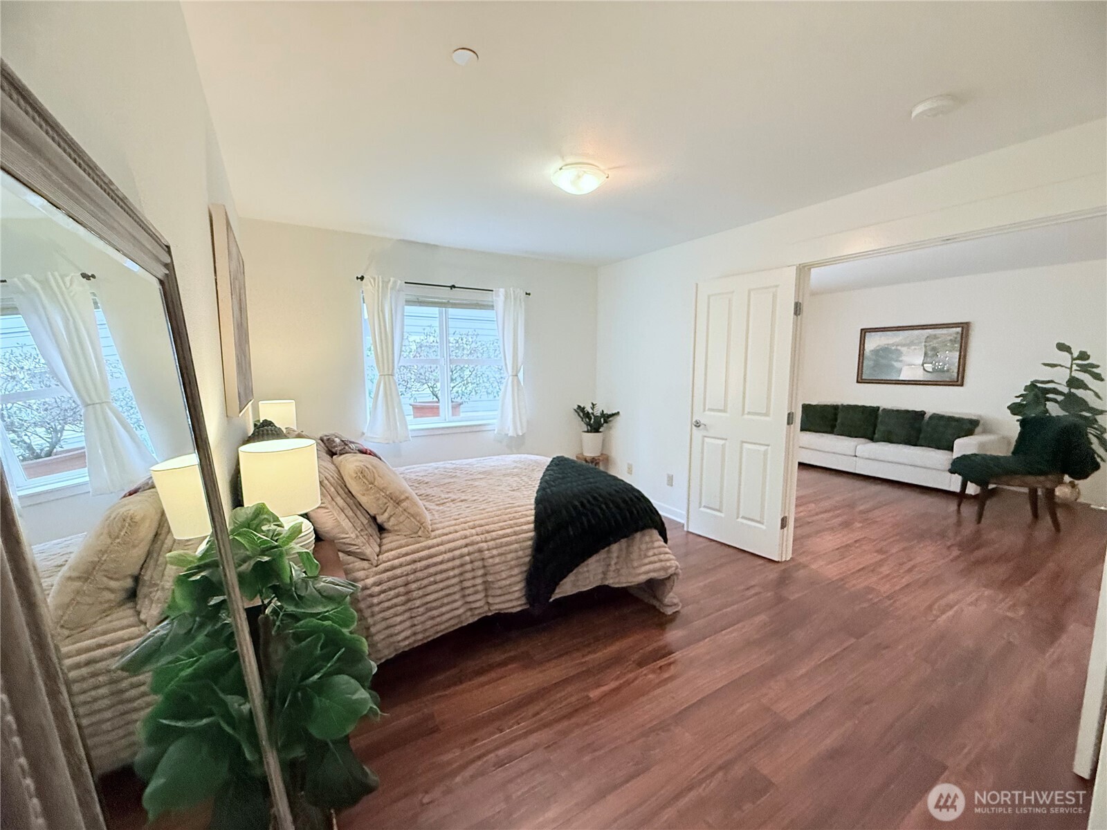 300 High School Road Northeast, Unit 203 Bainbridge Island, WA 98110 - Photo 10 of 13 a bedroom with furniture and a wooden floor