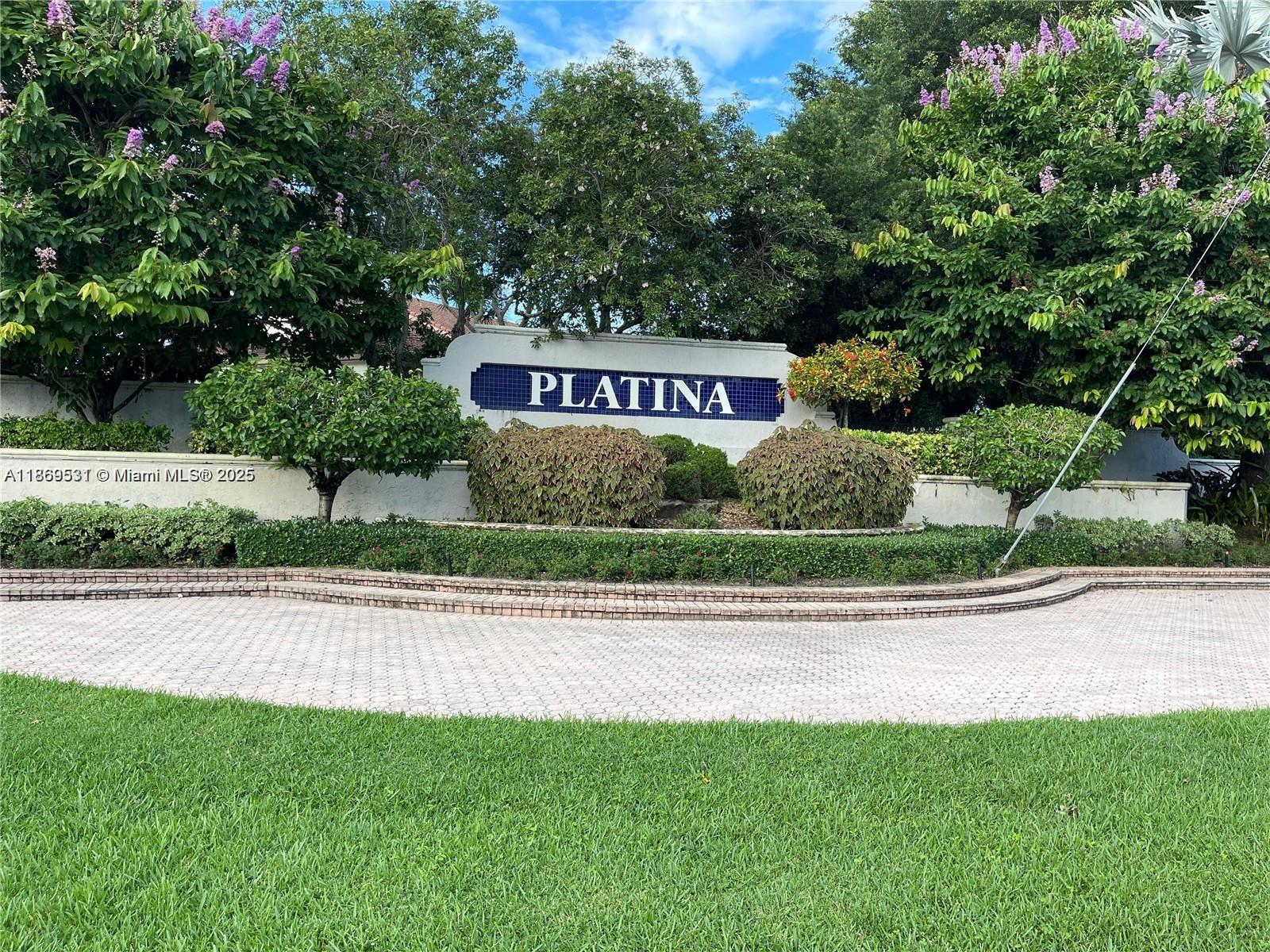 5133 Brisata Circle, Unit L Boynton Beach, FL 33437 - Photo 1 of 42 a sign that is on the side of a road