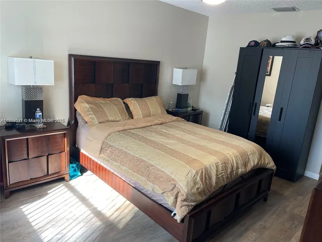 a bathroom with a sink a toilet and a shower