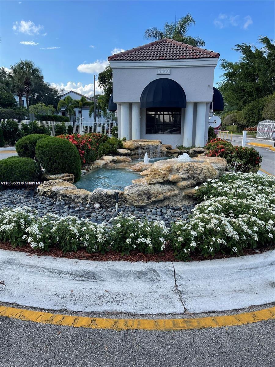 5133 Brisata Circle, Unit L Boynton Beach, FL 33437 - Photo 3 of 42 a front view of a house with a yard