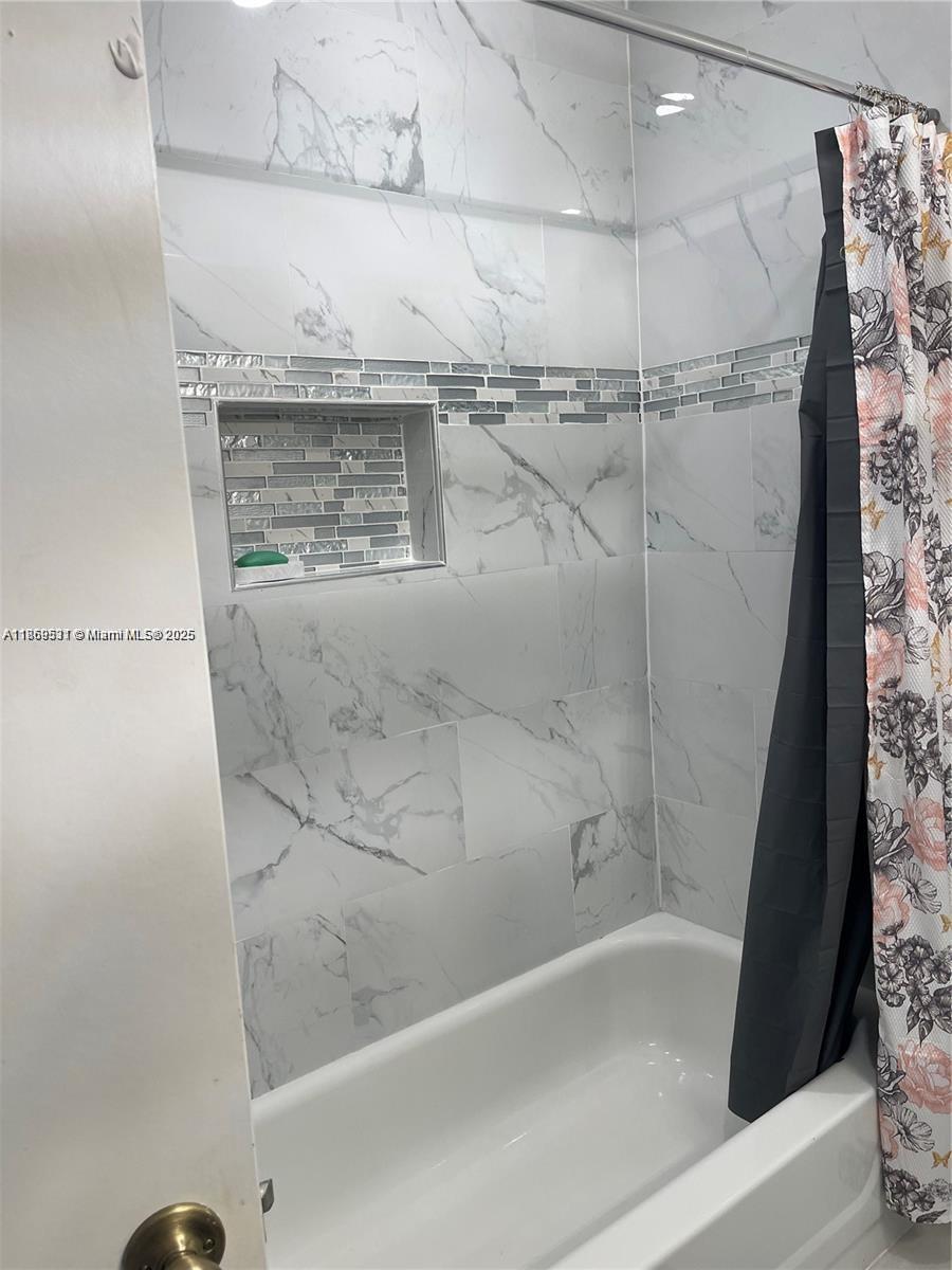 5133 Brisata Circle, Unit L Boynton Beach, FL 33437 - Photo 32 of 42 a bathroom with a shower