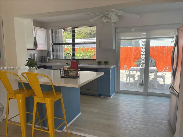 a kitchen with a sink and wooden cabinets