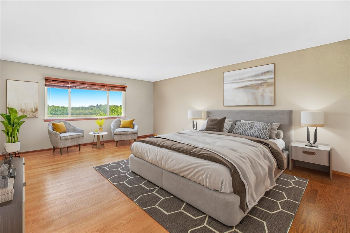2172 Prairie Trail Round Lake Heights, IL 60073 - Photo 11 of 28 a spacious bedroom with a bed a table and a window