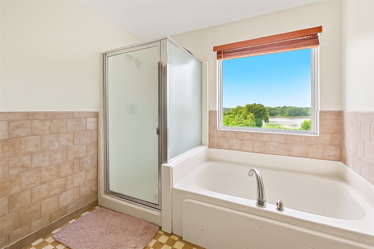 2172 Prairie Trail Round Lake Heights, IL 60073 - Photo 14 of 28 a white bath tub sitting next to a window