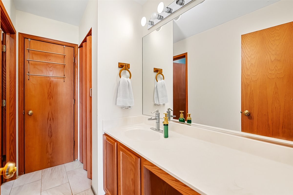 2172 Prairie Trail Round Lake Heights, IL 60073 - Photo 15 of 28 a bathroom with a sink and a mirror