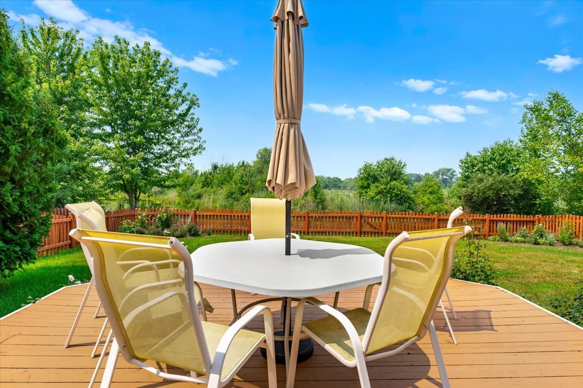 2172 Prairie Trail Round Lake Heights, IL 60073 - Photo 24 of 28 a view of a patio with a table chairs and a table