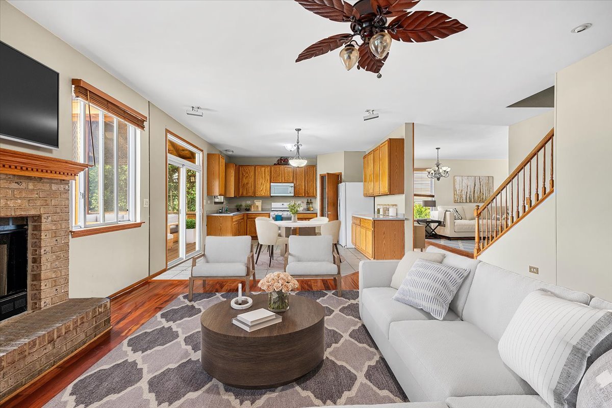 2172 Prairie Trail Round Lake Heights, IL 60073 - Photo 5 of 28 a living room with furniture kitchen view and a chandelier