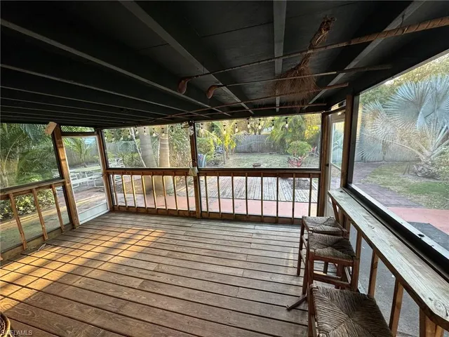 a view of a porch with wooden floor