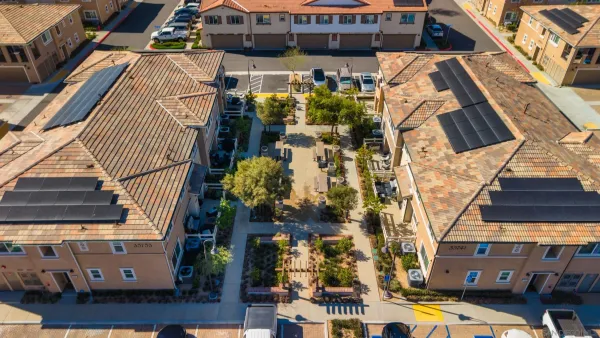 an aerial view of residential houses with a outdoor space