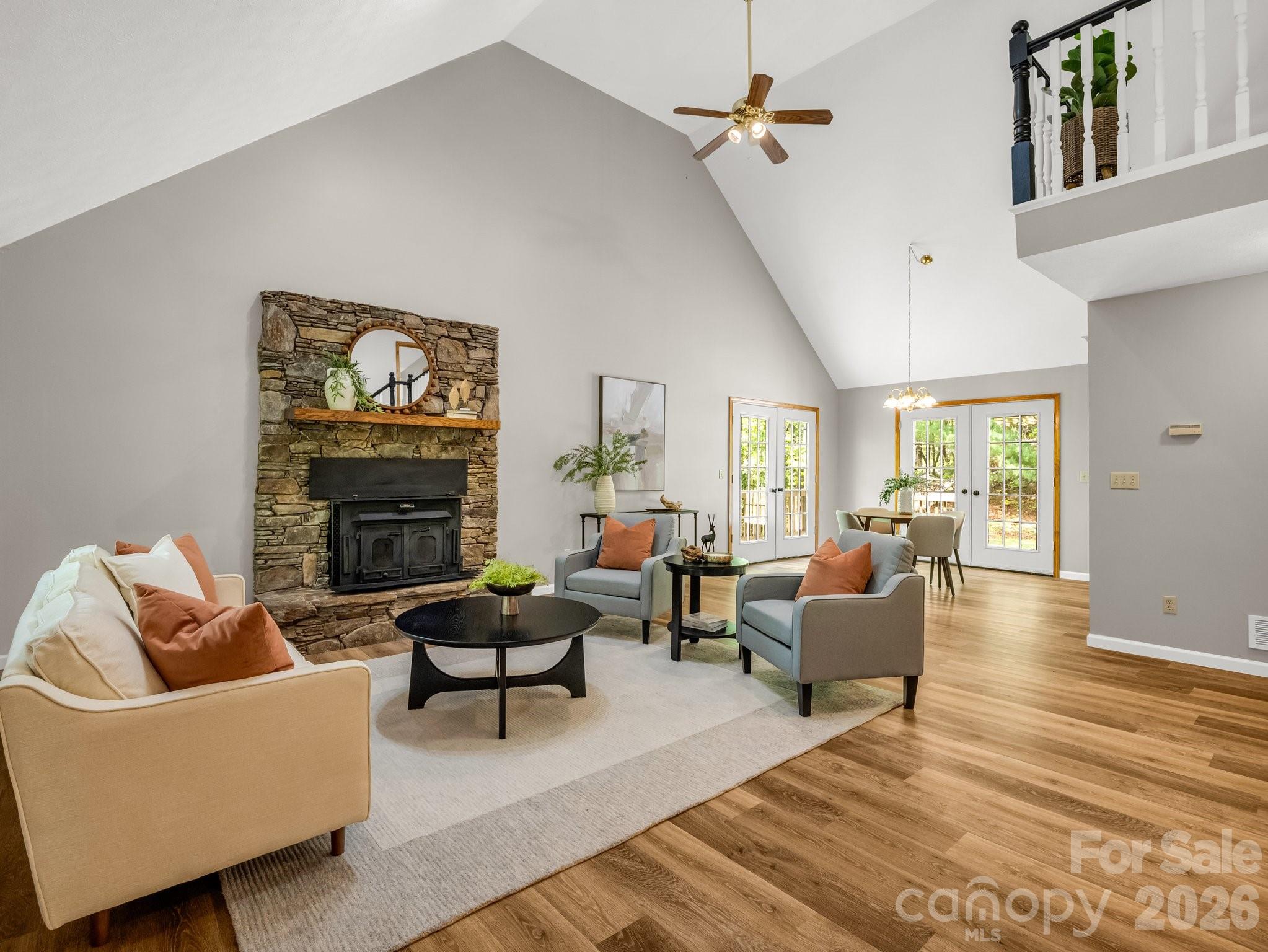 2304 Mountain Page Road Saluda, NC 28773 - Photo 2 of 38 a living room with furniture a fireplace and a flat screen tv