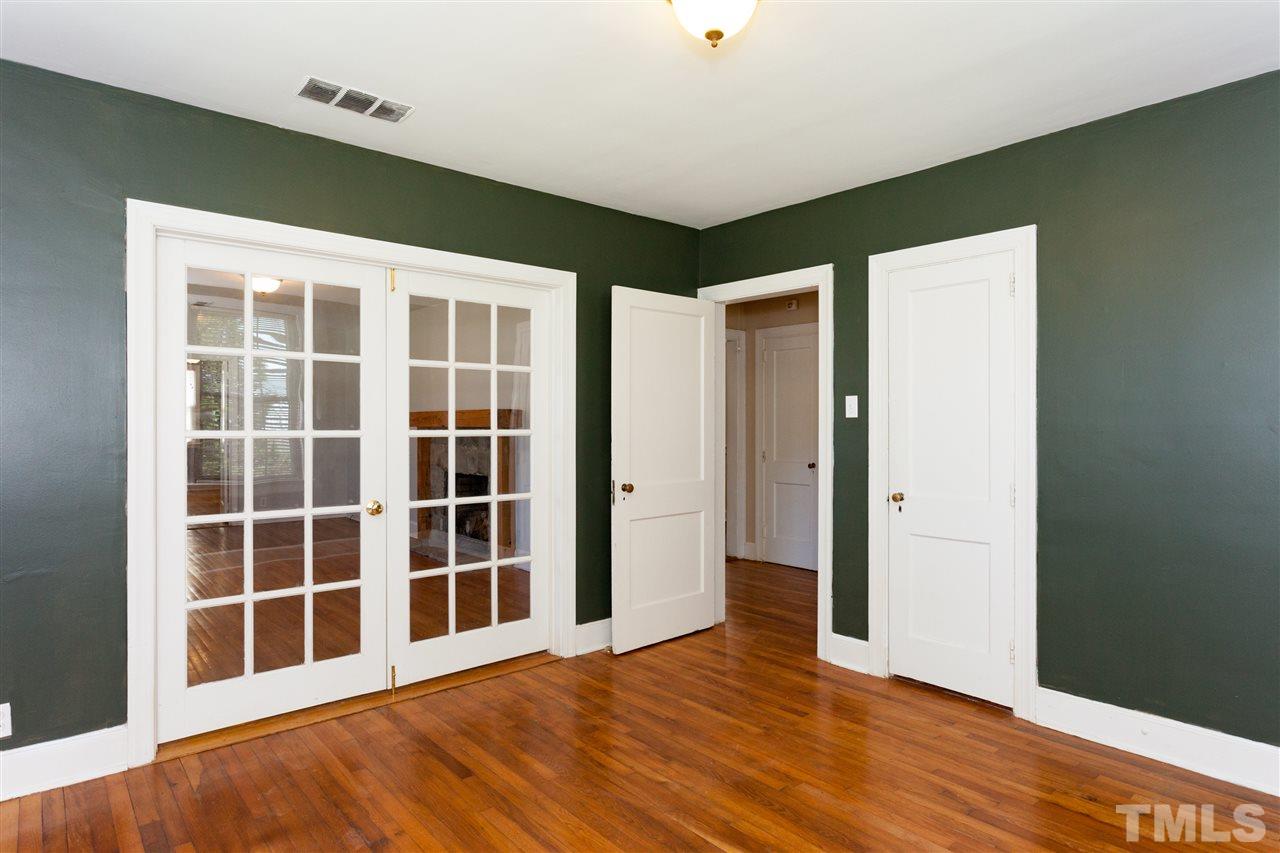 10819 North Roxboro Street Rougemont, NC 27572 - Photo 14 of 25 a view of an empty room with wooden floor and a window
